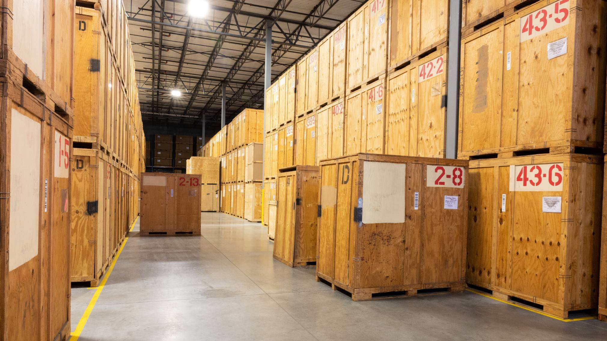 Sunbelt Moving Systems climate-controlled storage warehouse with numbered wooden vaults